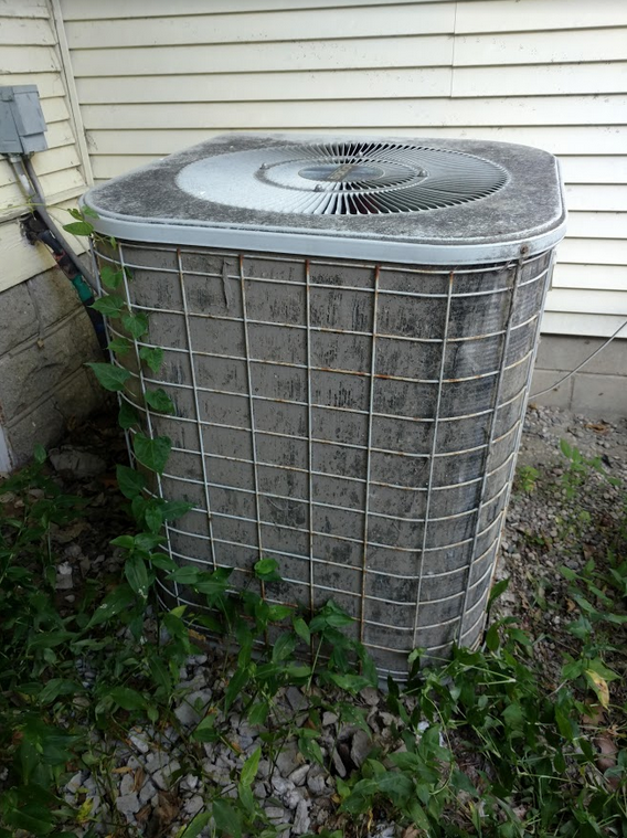 Dirty Air Conditioner outside of home